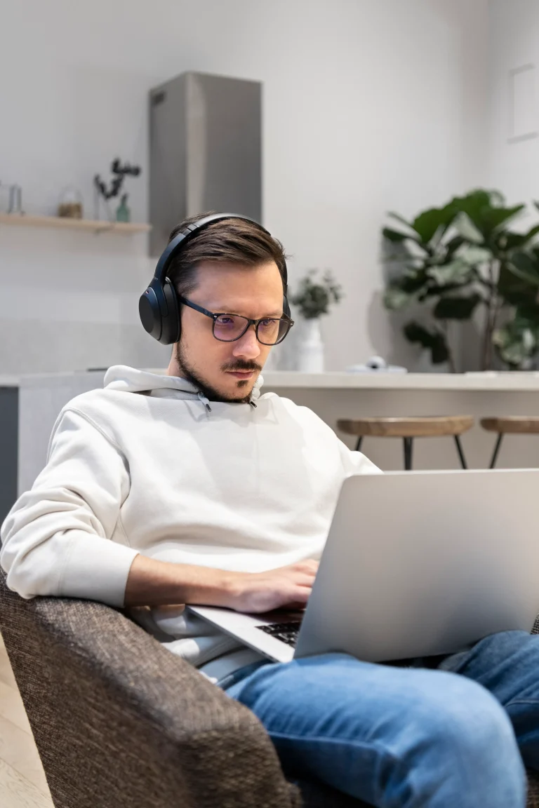 man-working-from-home-kitchen-with-laptop